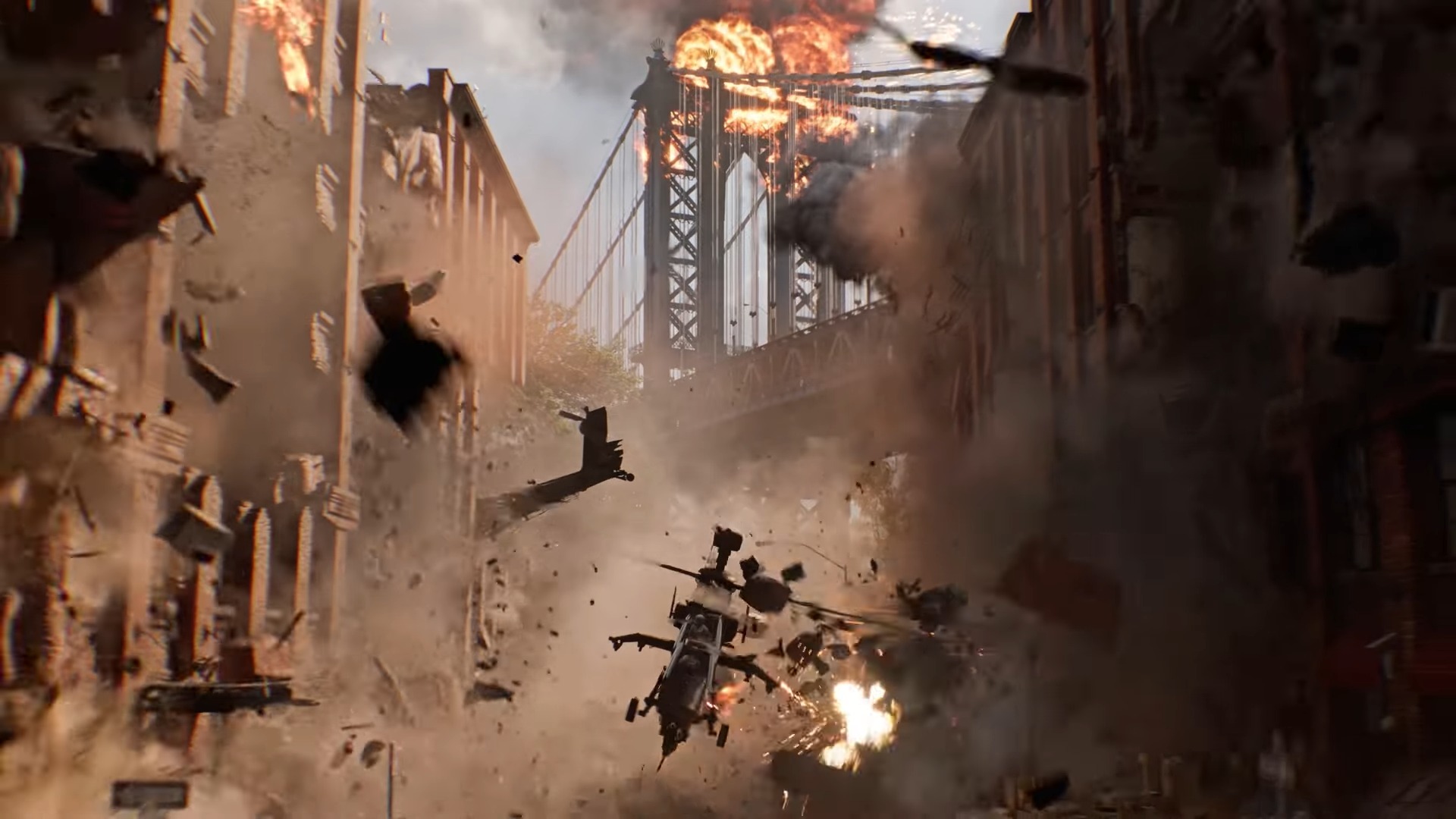 A helicopter flies through a city as buildings crumble, and a suspension bridge collapses in the background