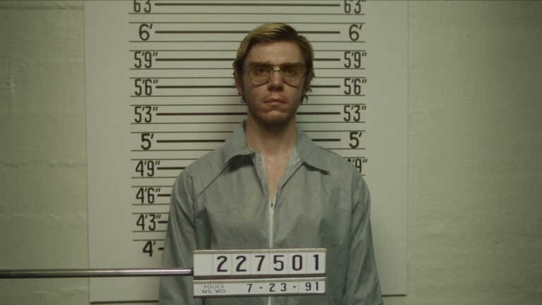 Jeffrey Dahmer stands for his mugshot photo