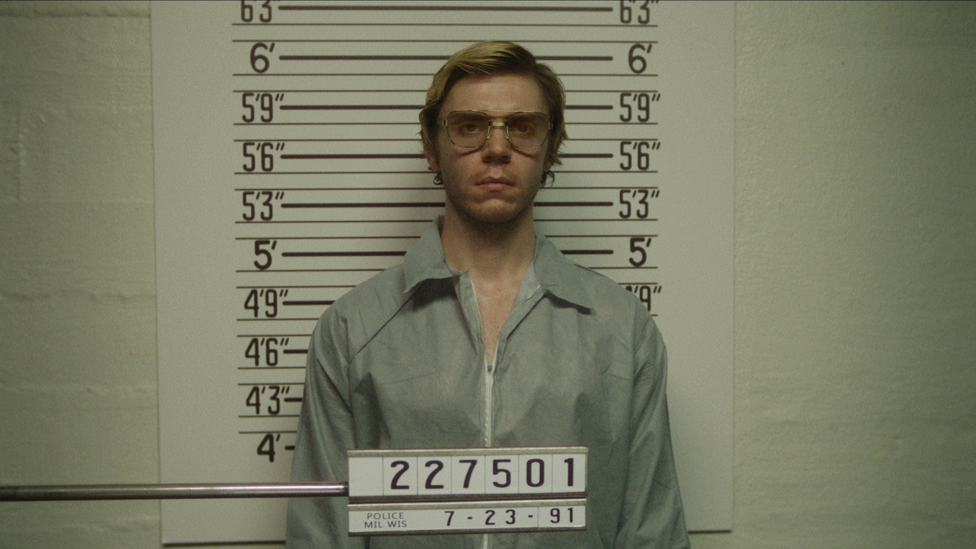 Jeffrey Dahmer stands for his mugshot photo